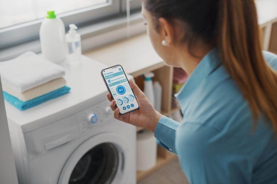 woman monitoring smart appliance